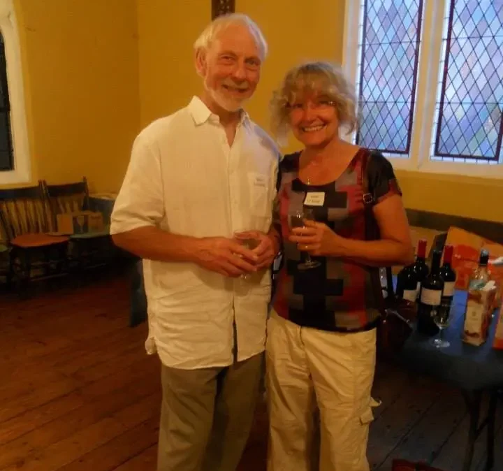 Irene and Steve serving wine