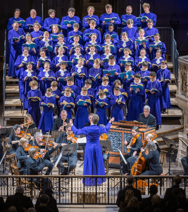 Norwich Cathedral Choir singing, dressed in blue
