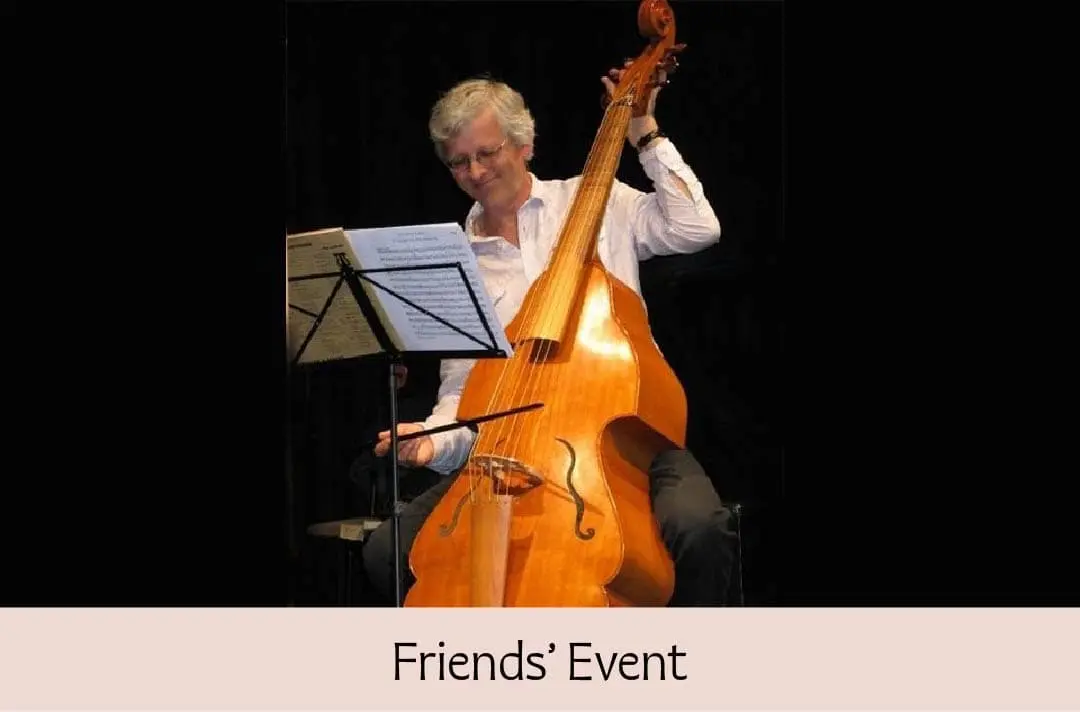 Action shot of William Hunt playing the violone